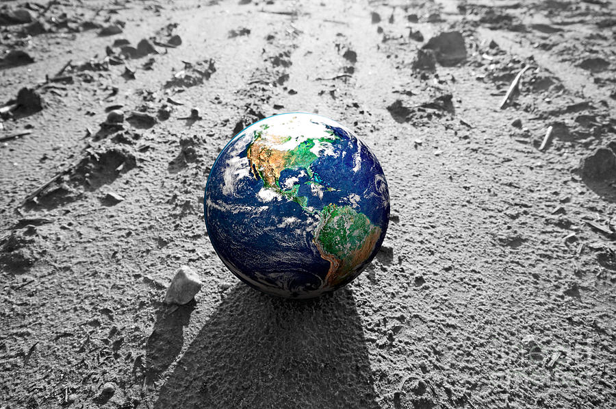 The Earth globe on rocky Mars like surface Photograph by Michal Bednarek