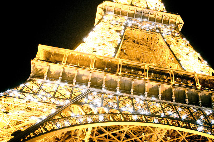 The Eiffel Tower at night Photograph by Raimond Klavins