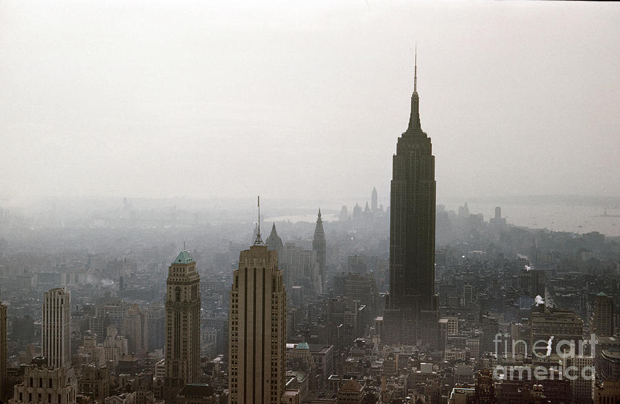 City Photograph - The Empire State Building is seen from the Top of The Rock in Rockefeller Center 1957 by Monterey County Historical Society