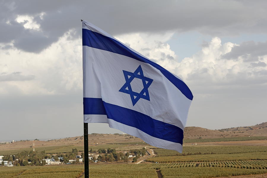 Flag Photograph - The flag of Israel waving in the Golan Heights israel by Ronald Jansen