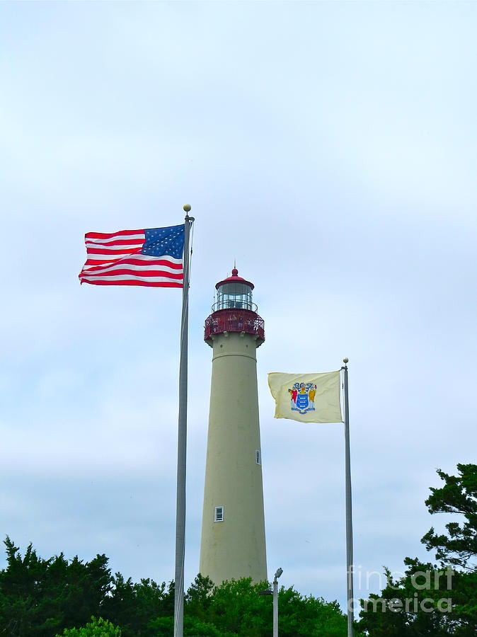 The Flags at Cape May Light  Photograph by Nancy Patterson