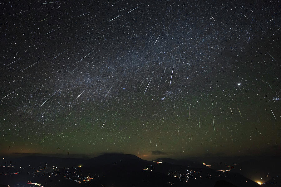 Space Photograph - The Geminids Meteor Shower Streaks by Jeff Dai