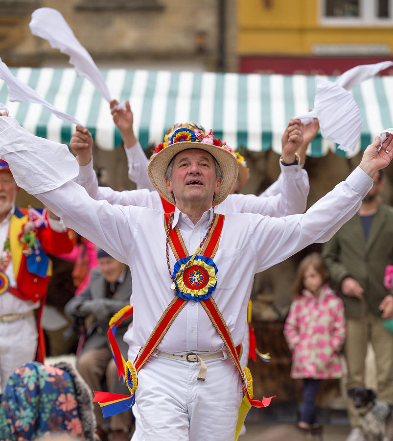 The Gloucestershire Morris Men performing a traditional dance at the Fleece Fair in Cirencester Market Place Photograph by Raylipscombe