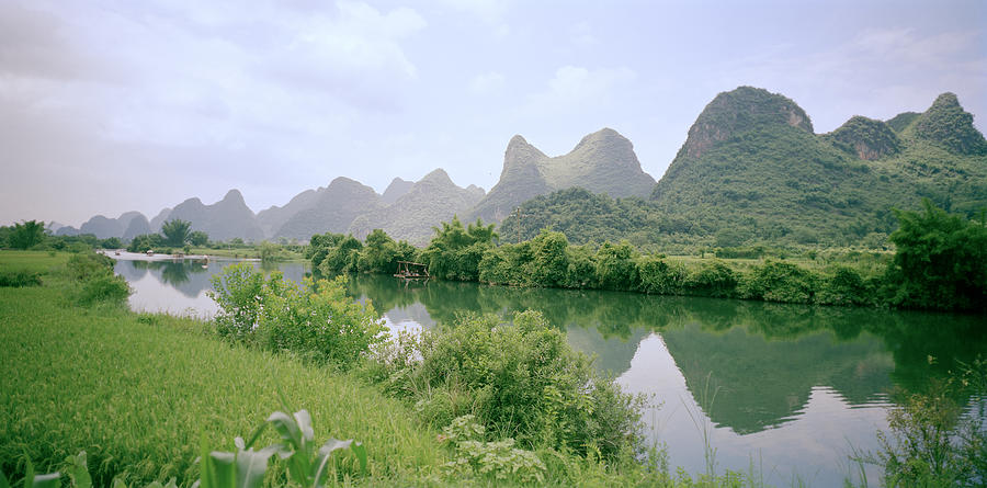 The Guilin Mountains In China Photograph by Shaun Higson