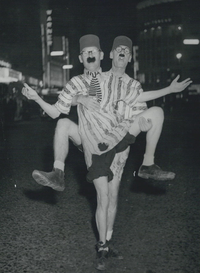 Vintage Photograph - The Happy Wanderers Will Busk On Broadway. by Retro Images Archive