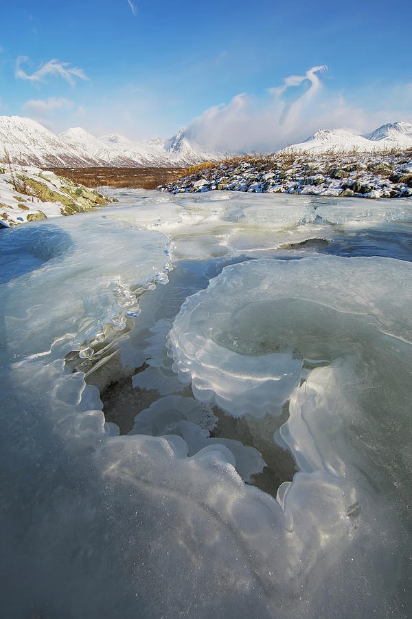 The Ice In A Stream Leading Off Into A Photograph by Robert Postma / Design Pics