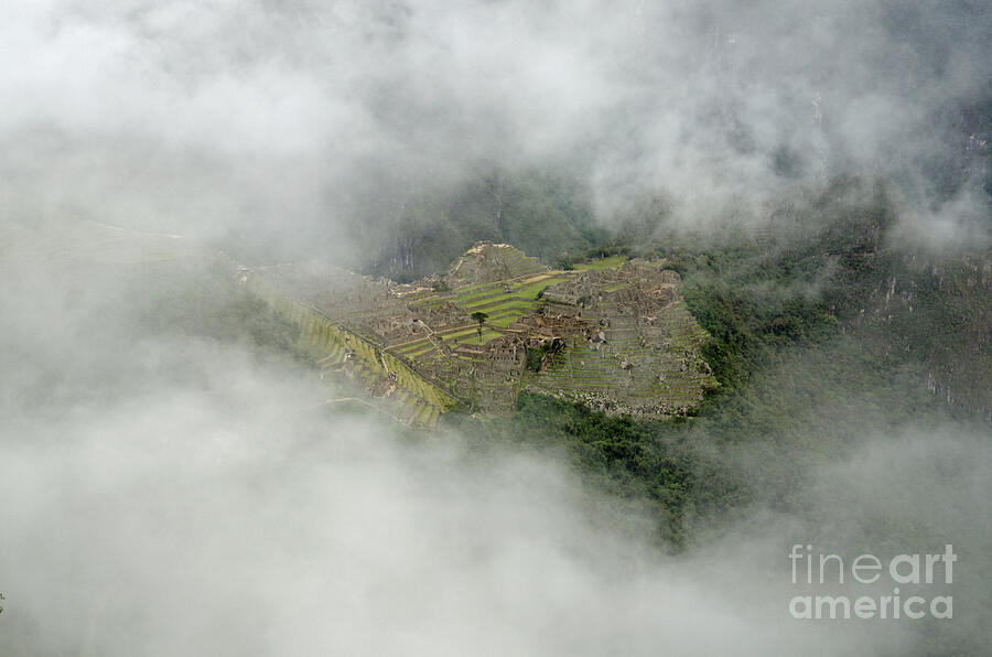 The Inca village of Machu Picchu through the clouds Photograph by Ralf ...