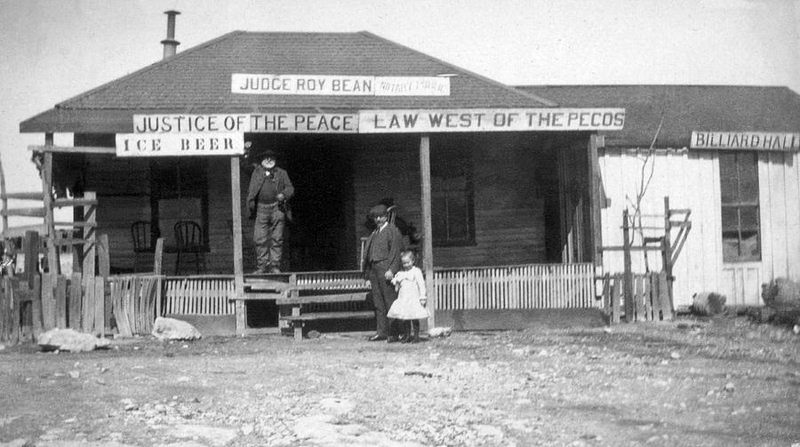 Black And White Photograph - The Law West Of The Pecos by Underwood Archives