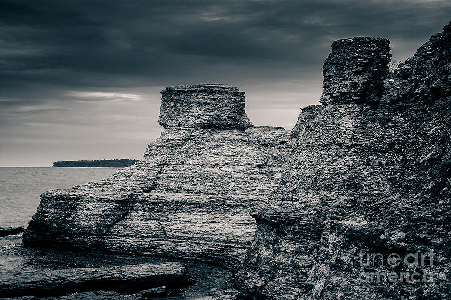 The layered eroded limestone pillars at Byerum Rauker Oland Sweden Photograph by Peter Noyce