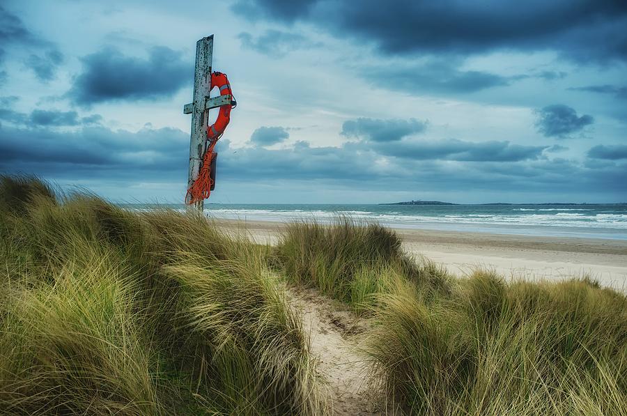 Beach Photograph - The Lifesaver by Ray Cooper