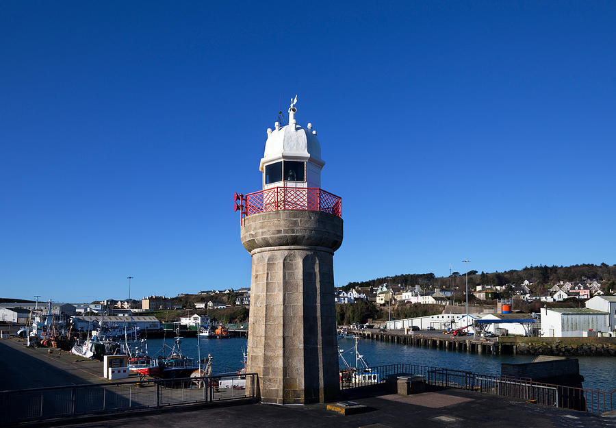 Pier Photograph - The Lighthouse And Fishing Harbour by Panoramic Images