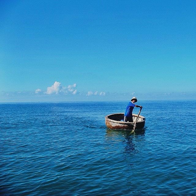 The Lonely Boatman. Mui Ne. Vietnam Photograph by Evgeny Poliganov