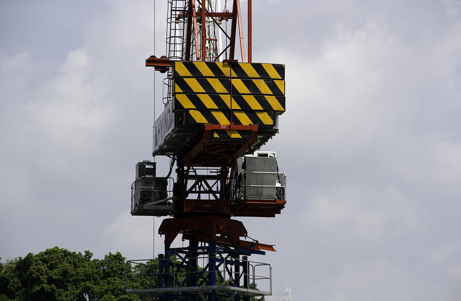 The middle section of a crane in Singapore Photograph by Ashish Agarwal