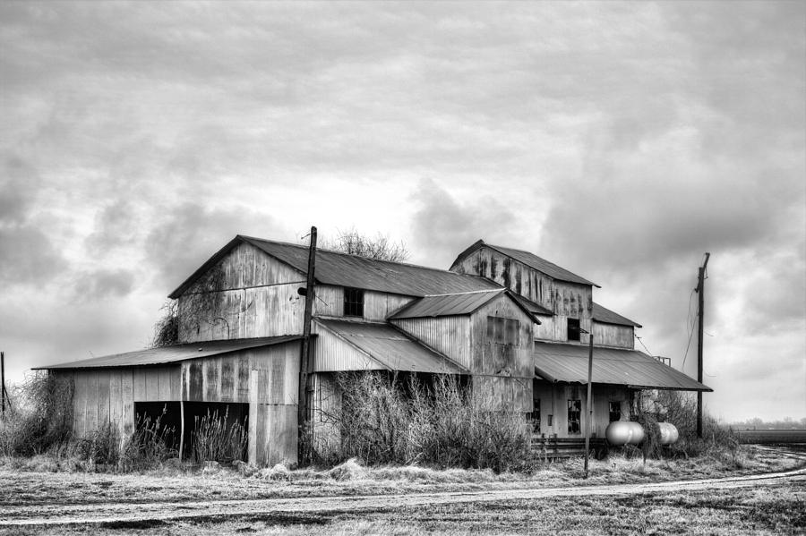 Black And White Photograph - The Mississppi Delta Cotton Gin Black and white by JC Findley