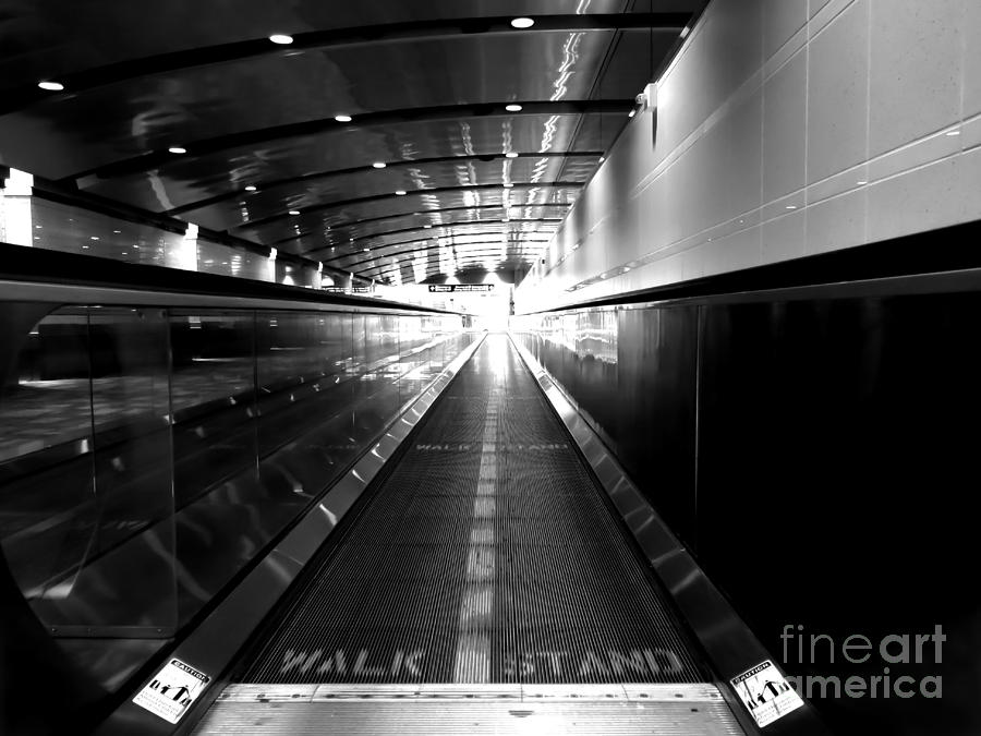The Moving Walkway Photograph by Bob Mintie