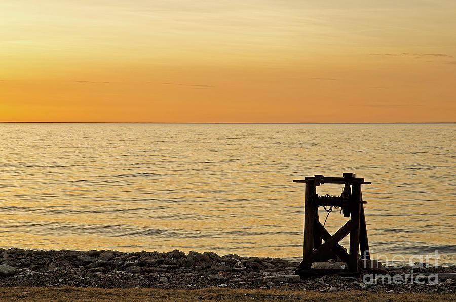 Sunset Photograph - The Old Boat Winch by Kennerth and Birgitta Kullman