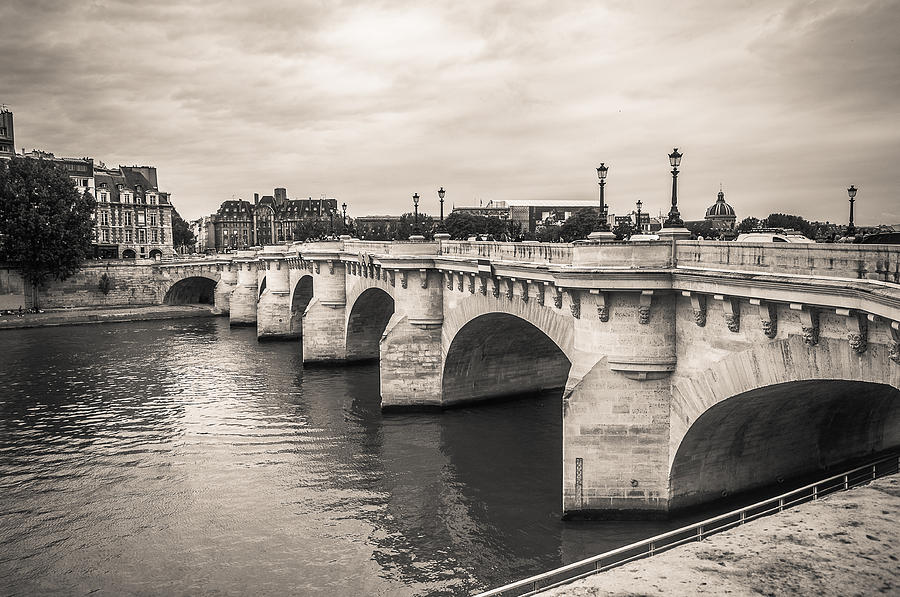 The oldest bridge of Paris Photograph by Sergey Simanovsky