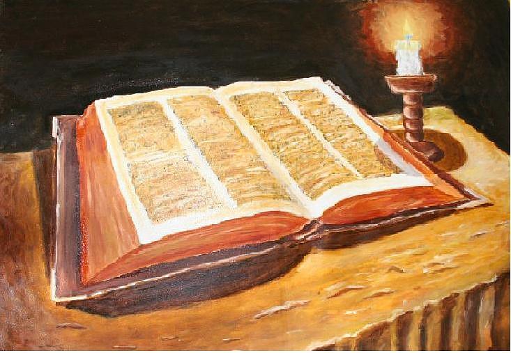 open bible with candle