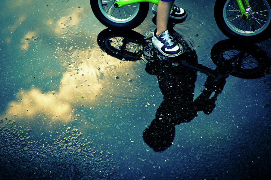 The Reflection Of The Little Boy Riding Photograph by Clover No.7 Photography