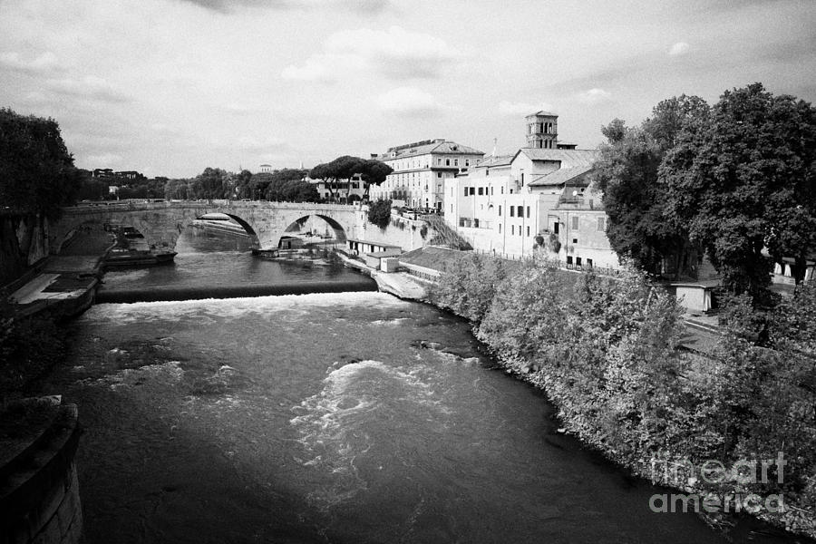 City Photograph - The River Tiber runs past the Isola Tiberna Rome Lazio Italy by Joe Fox