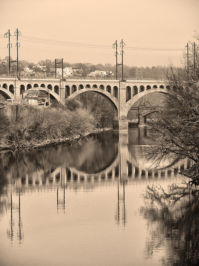 The Schuylkill River and manayunk Bridge in Sepia Photograph by Bill Cannon