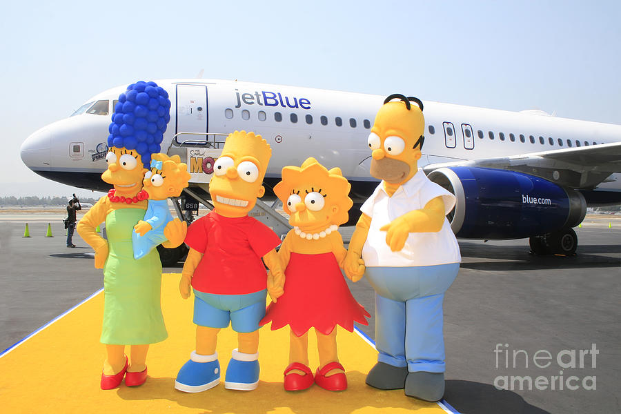 The Simpsons are ready to board their plane Photograph by Nina Prommer