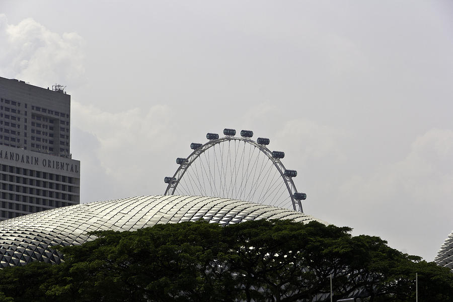 The Singapore Flyer and the Mandarin Oriental hotel and the Esplanade Building in Singapore Photograph by Ashish Agarwal