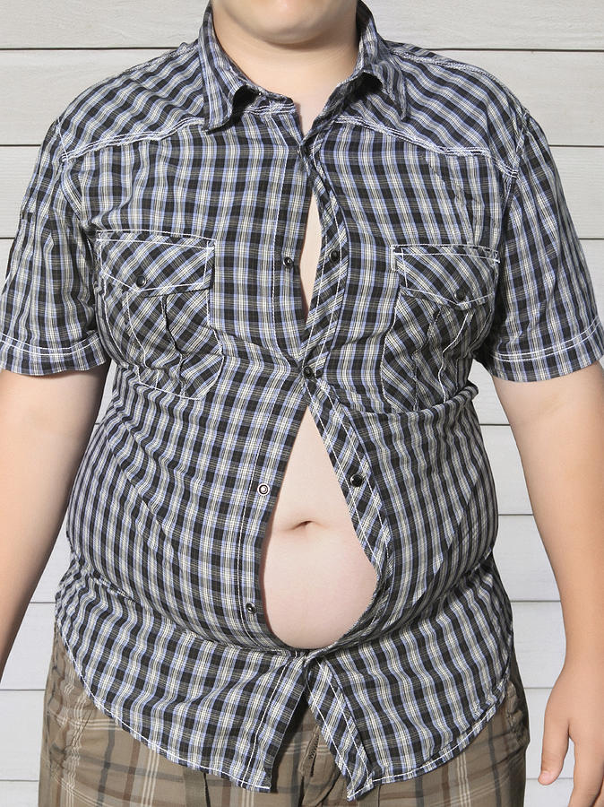 The torso of an overweight young teenage boy Photograph by Steven Puetzer
