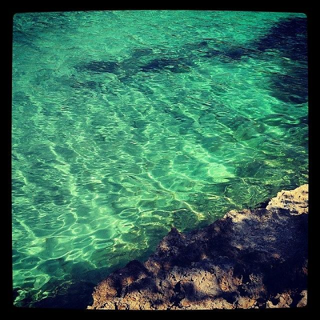 Water Photograph - The Tranquil Waters Of Mallorca by Theo Knipe