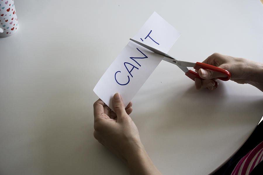The word CANT, with the T cut off to spell CAN Photograph by Melinda Podor