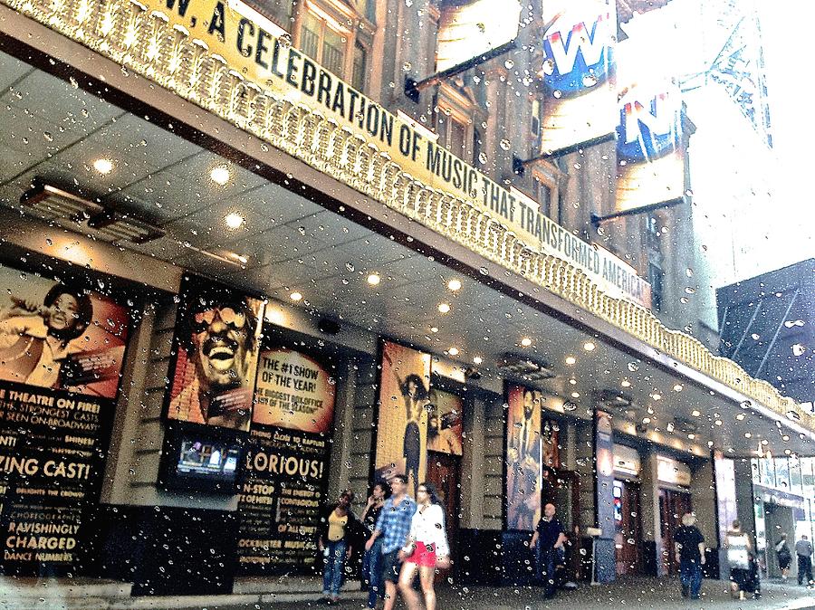 Theater In The Rain Photograph by Gillis Cone