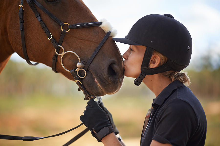 There is a bond between horse and rider Photograph by PeopleImages