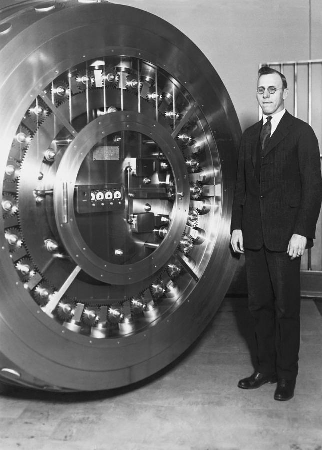 Black And White Photograph - Thirty Ton Bank Vault Door by Underwood Archives