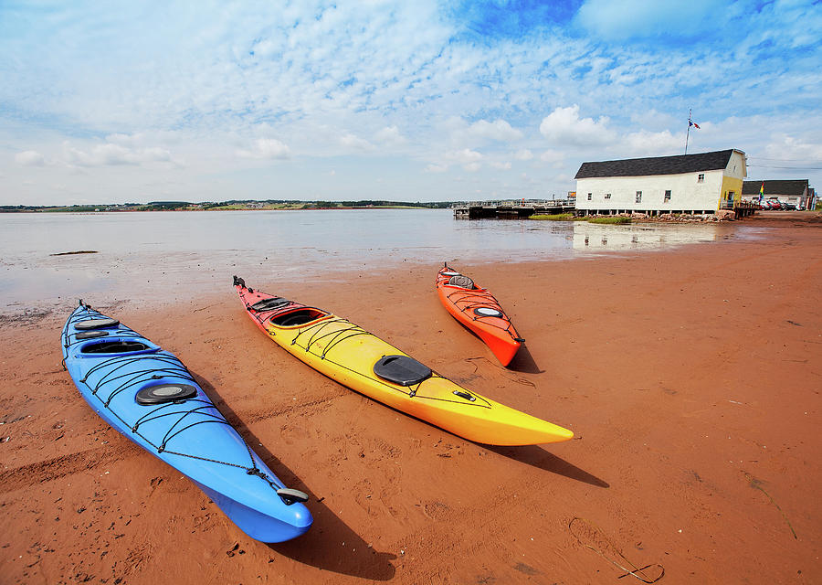 Three Beached Sea Kayaks Photograph by Daniel Haug