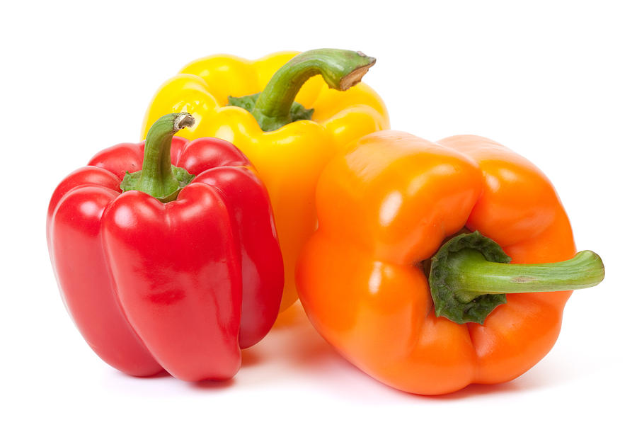Three bell peppers, a red, a yellow and an orange one Photograph by Jsolie