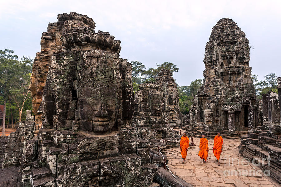 Three buddhist monks at Bayon temple - Angkor - Cambodia Photograph by Matteo Colombo