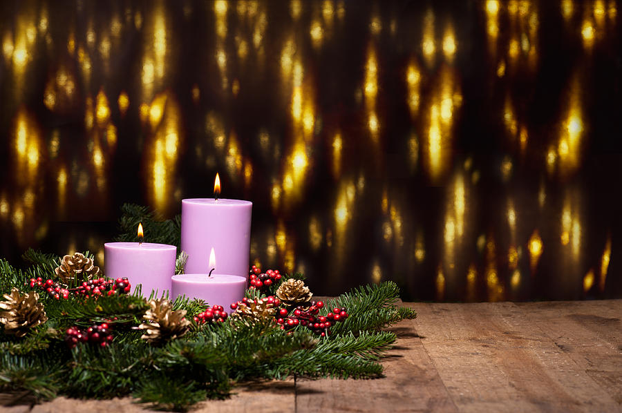 Holiday Photograph - Three candles in an advent flower arrangement by U Schade