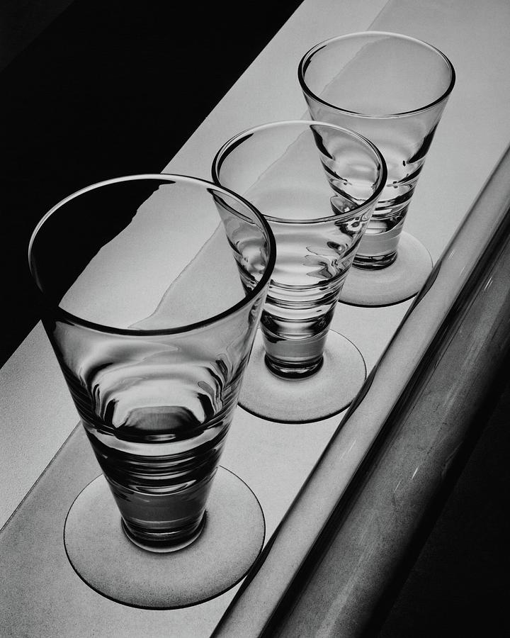 Three Glasses On A Shelf Photograph by Martin Bruehl