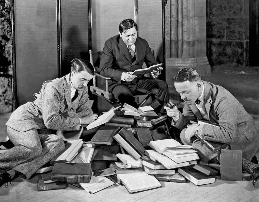 Three Men Searching Books Photograph by Underwood Archives