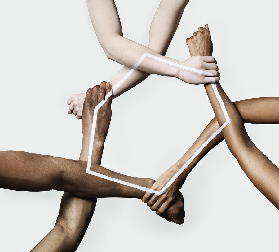 Three peoples hands and arms forming a triangle Photograph by Henrik Sorensen