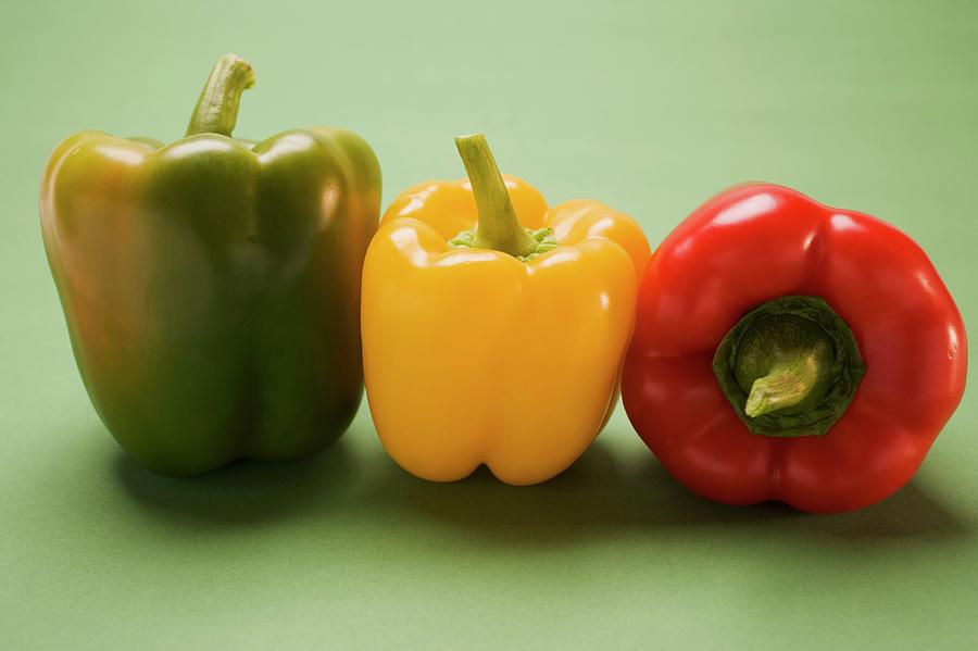 Three Peppers (yellow, Red, Green) In A Row Photograph by ...