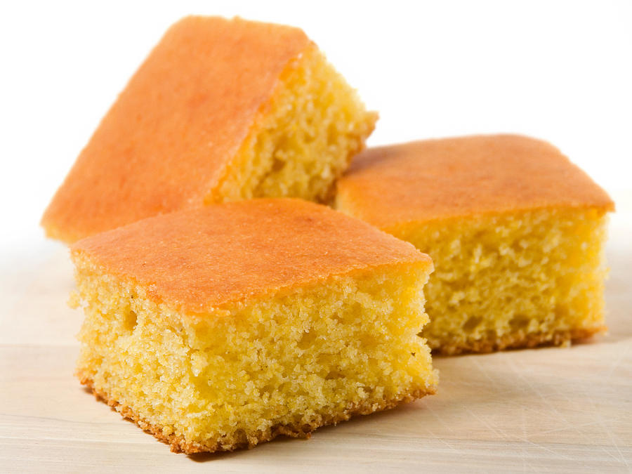 Three pieces of cornbread on white Photograph by Kcline