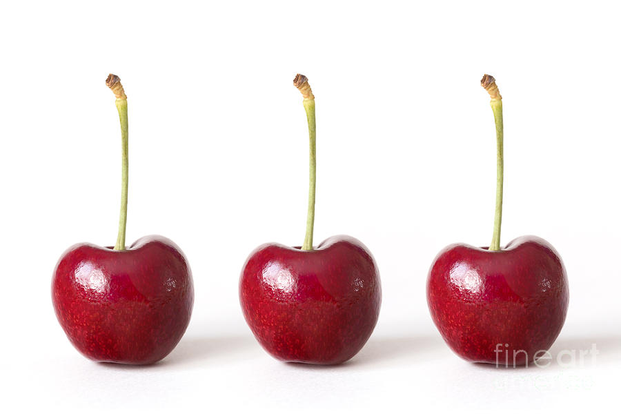 Three Red Cherries against a White Background Photograph by Natalie Kinnear