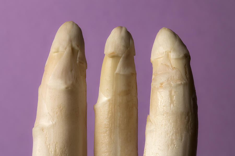 Three stalks of white asparagus suggestive of three penises Photograph by Larry Washburn