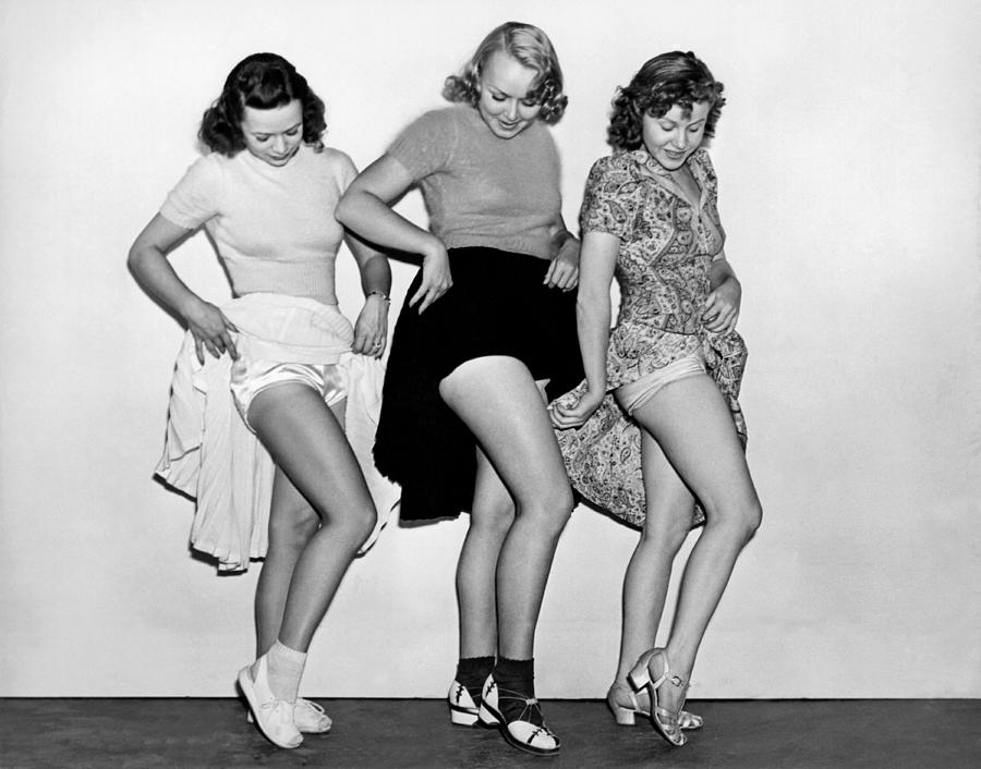 Three Women Lift Their Skirts Photograph by Underwood Archives