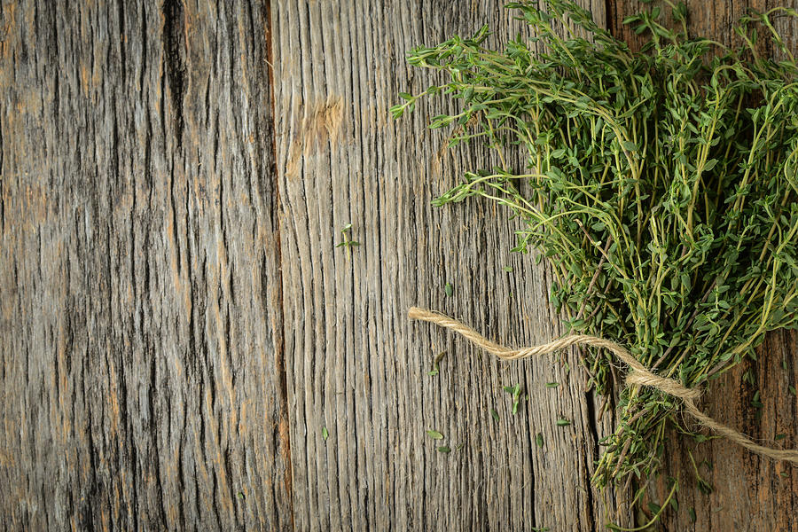 Thyme on Wood Background Photograph by Brandon Bourdages