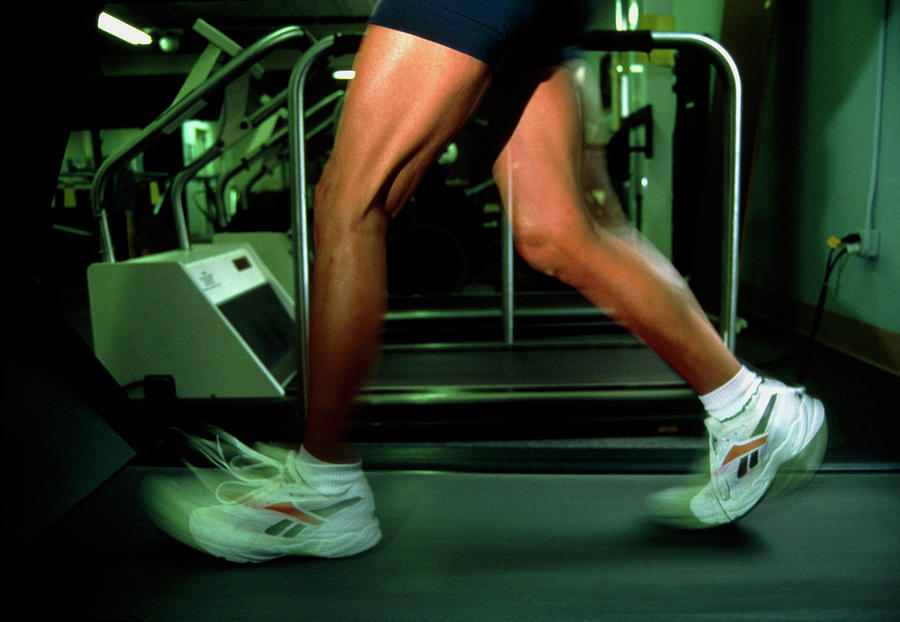 Timeexposure Image Of Legs Running On A Treadmill Photograph by Stevie Grand/science Photo