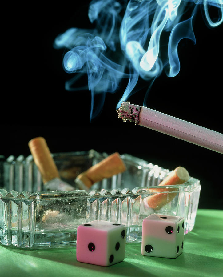 Tobacco Cigarette Seen Above Two Dice Photograph by Sheila Terry/science Photo Library