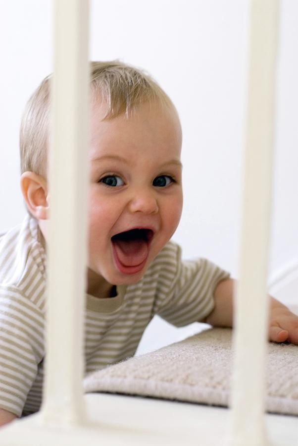 Toddler Crawling Up Stairs Photograph by Suzanne Grala/science Photo Library