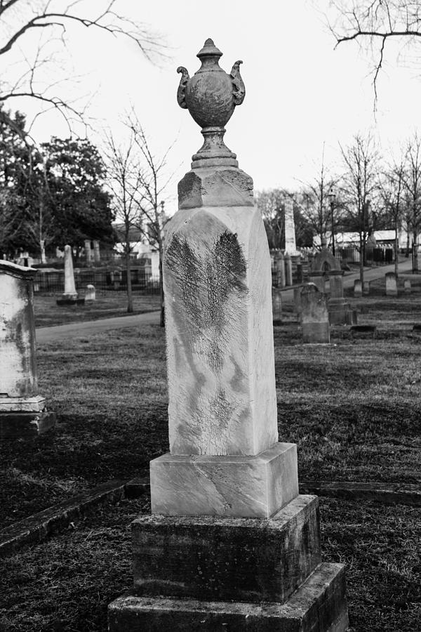 Tombstone in black and white Photograph by Robert Hebert